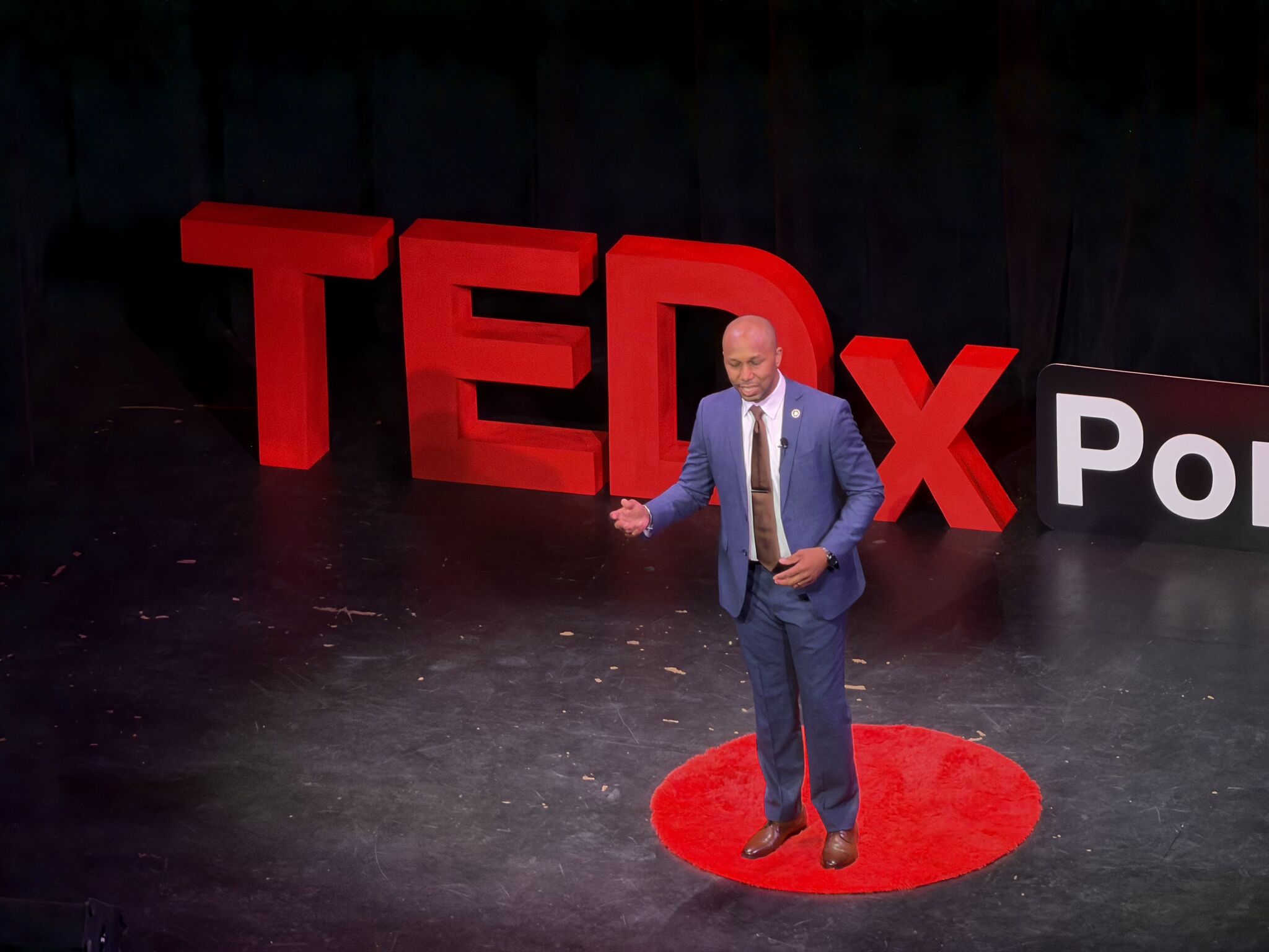 Marc D. Alexander on the TEDxPontiac red circle stage